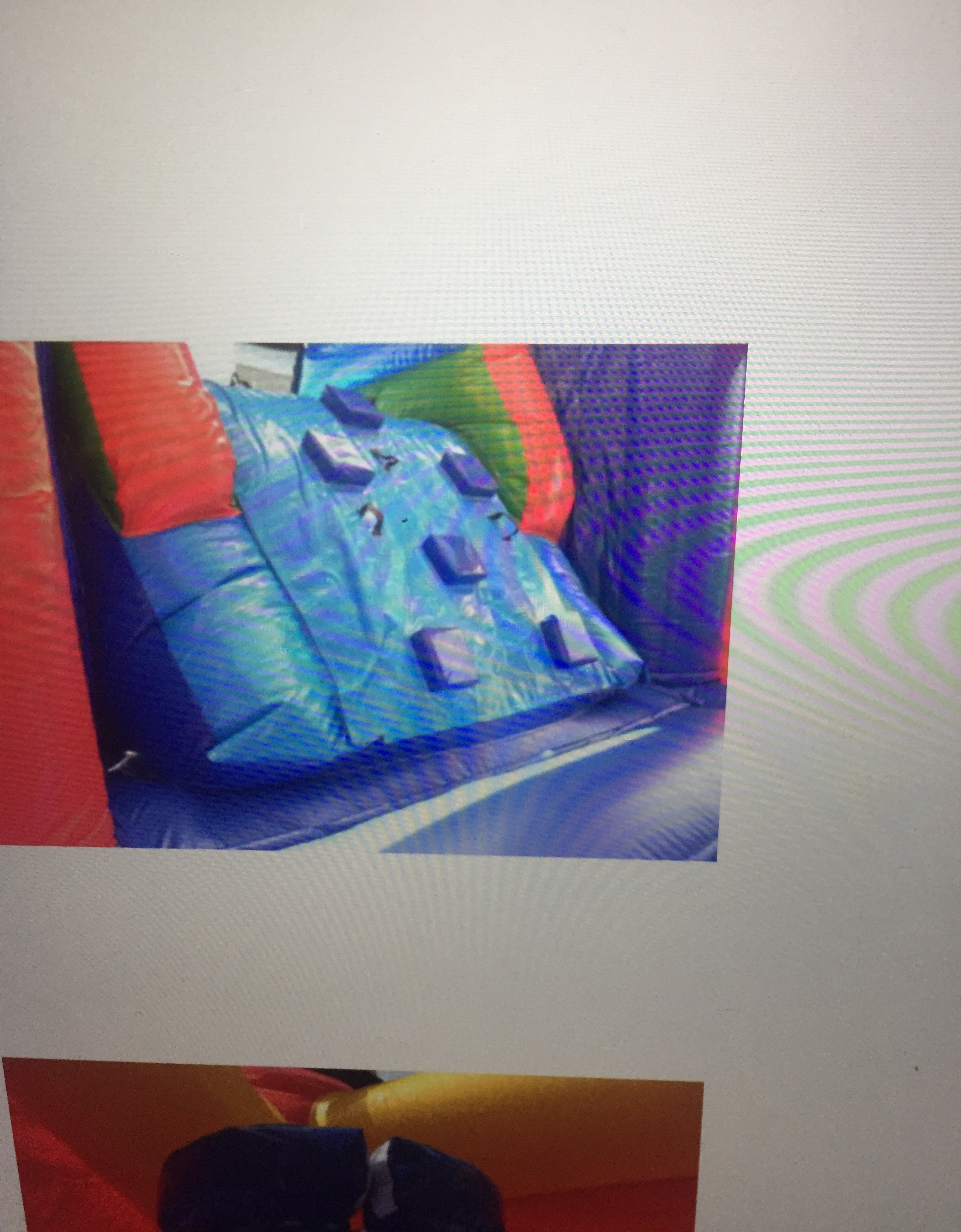 Colorful inflatable slide setup at party event
